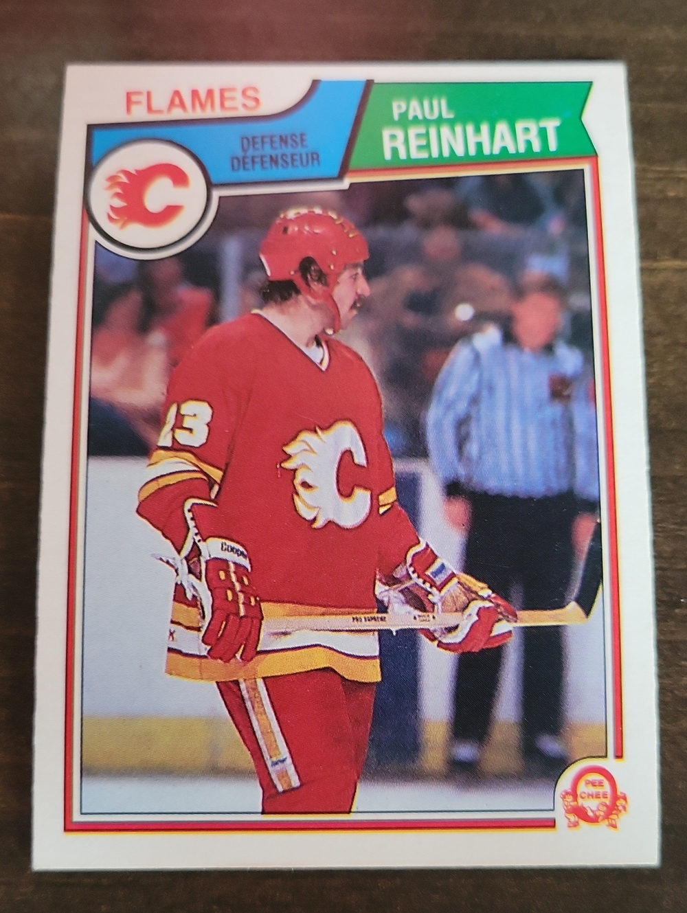 1983/84 OPC Calgary Flames Paul Reinhart Hockey Card — Red & Yellow